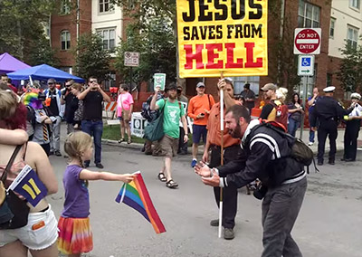 little_girl_faces_off_gay_hate_preacher_with_rainbow_flag