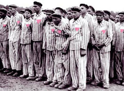 Gay men, wearing pink triangles, in a Nazi concentration camp